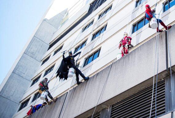 superheroes clean hospital windows