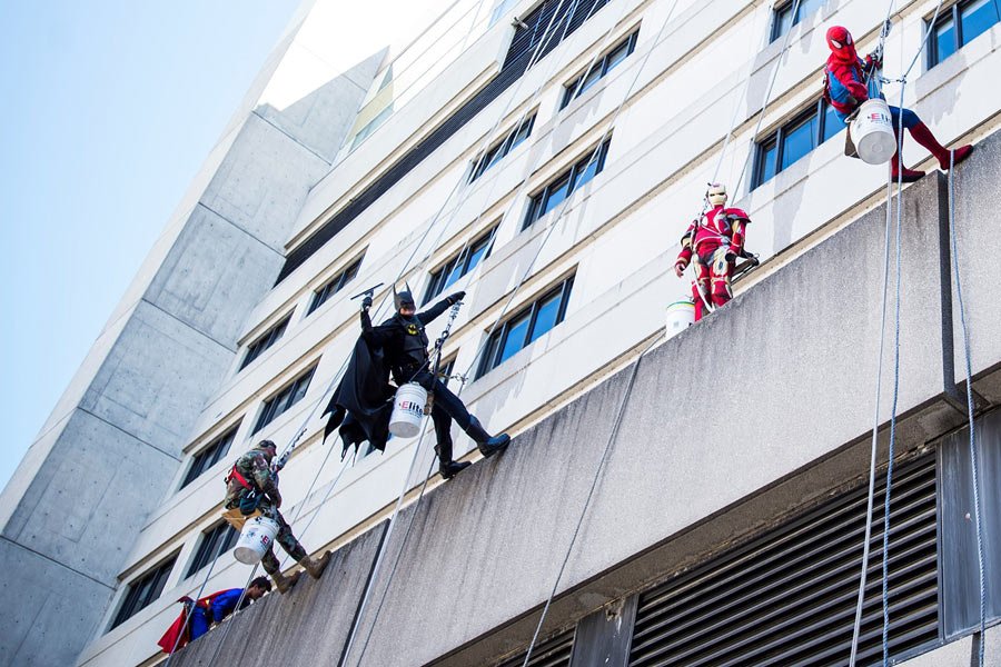 superheroes clean hospital windows